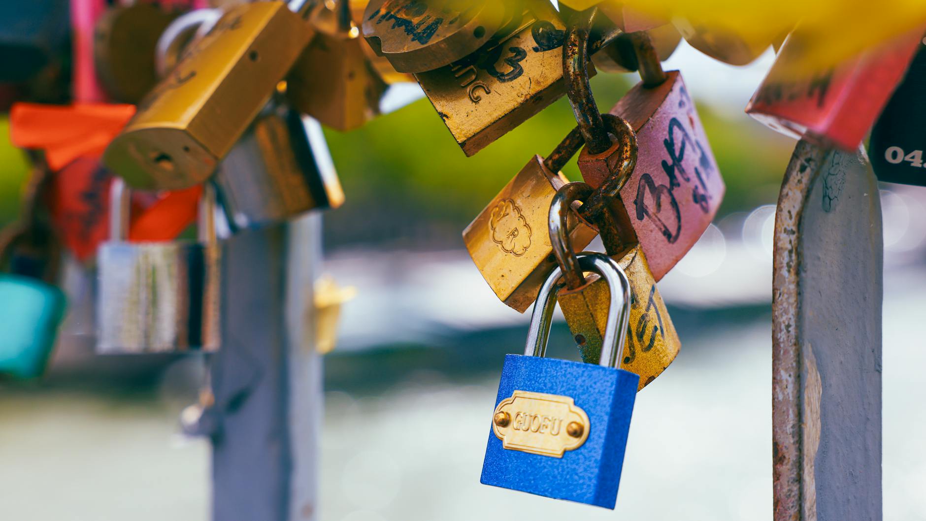 Vibrant love locks attached to a bridge railing in Paris, symbolizing love and commitment.