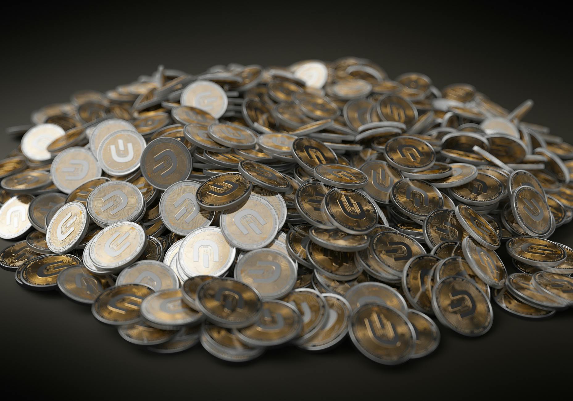 A close-up view of a large pile of gold and silver cryptocurrency coins indicating financial wealth.