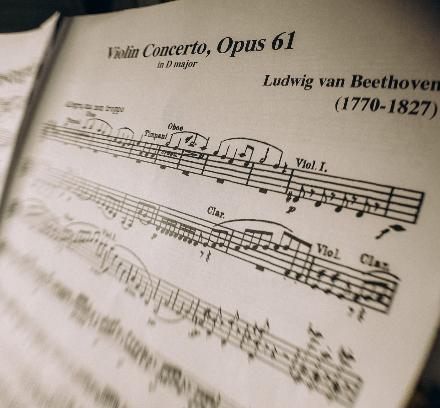 A detailed view of Beethoven's Violin Concerto sheet music, showcasing musical notes and dynamics.