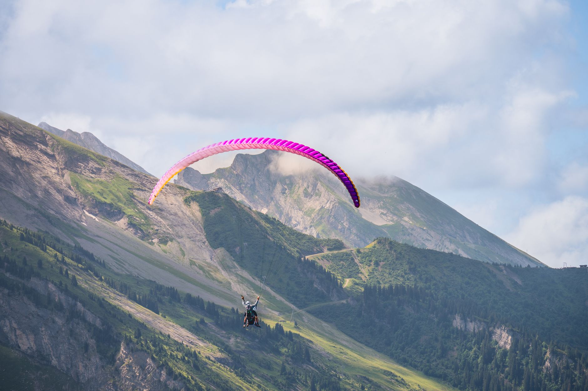 Experience thrilling paragliding over stunning mountain landscapes, perfect for adventure seekers.